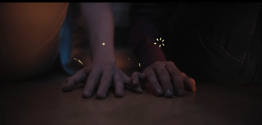 Nick and Charlie's pinkies touching and small animated explosions around them.