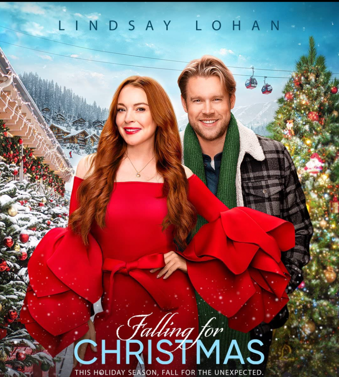 Promo image for movie Sierra is wearing a designer red outfit with large sleeves. Jake is in plaid. They are in front of Christmas trees and ski lodges. Lindsay Lohan has top billing. The title is below them and the tagline THIS HOLIDAY SEASON FALL FOR THE UNEXPECTED.